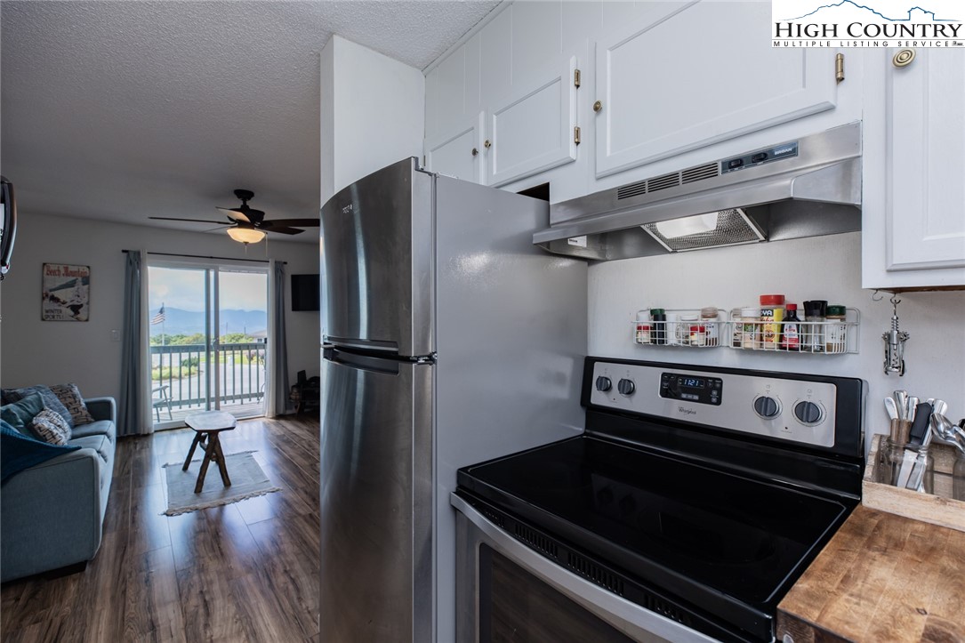 301 Pinnacle Inn Road, Unit 4305 Beech Mountain, NC 28604 - Photo 13 of 49 a kitchen with stainless steel appliances granite countertop a refrigerator stove and sink
