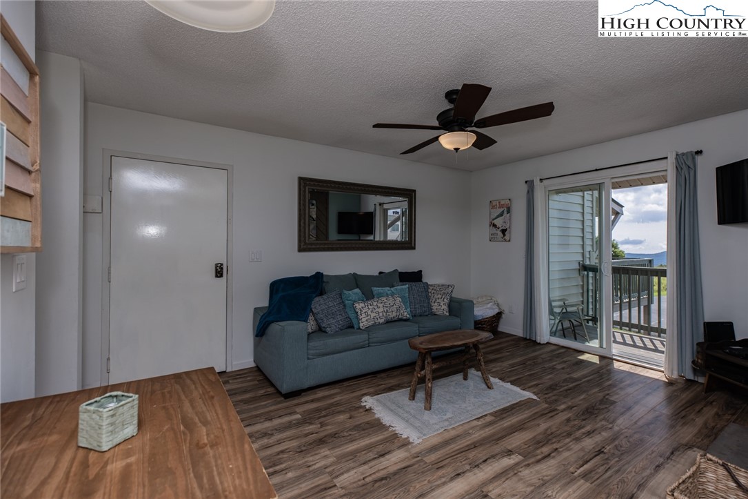 301 Pinnacle Inn Road, Unit 4305 Beech Mountain, NC 28604 - Photo 28 of 49 a living room with furniture and a ceiling fan