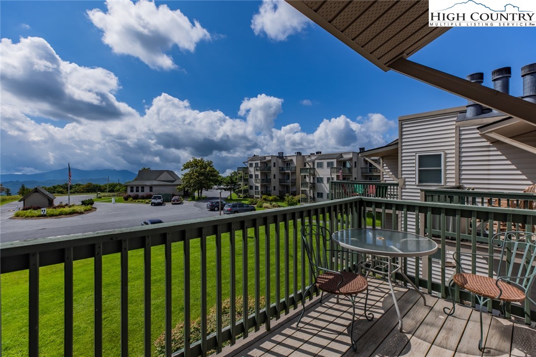 301 Pinnacle Inn Road, Unit 4305 Beech Mountain, NC 28604 - Photo 30 of 49 a view of a balcony with two chairs