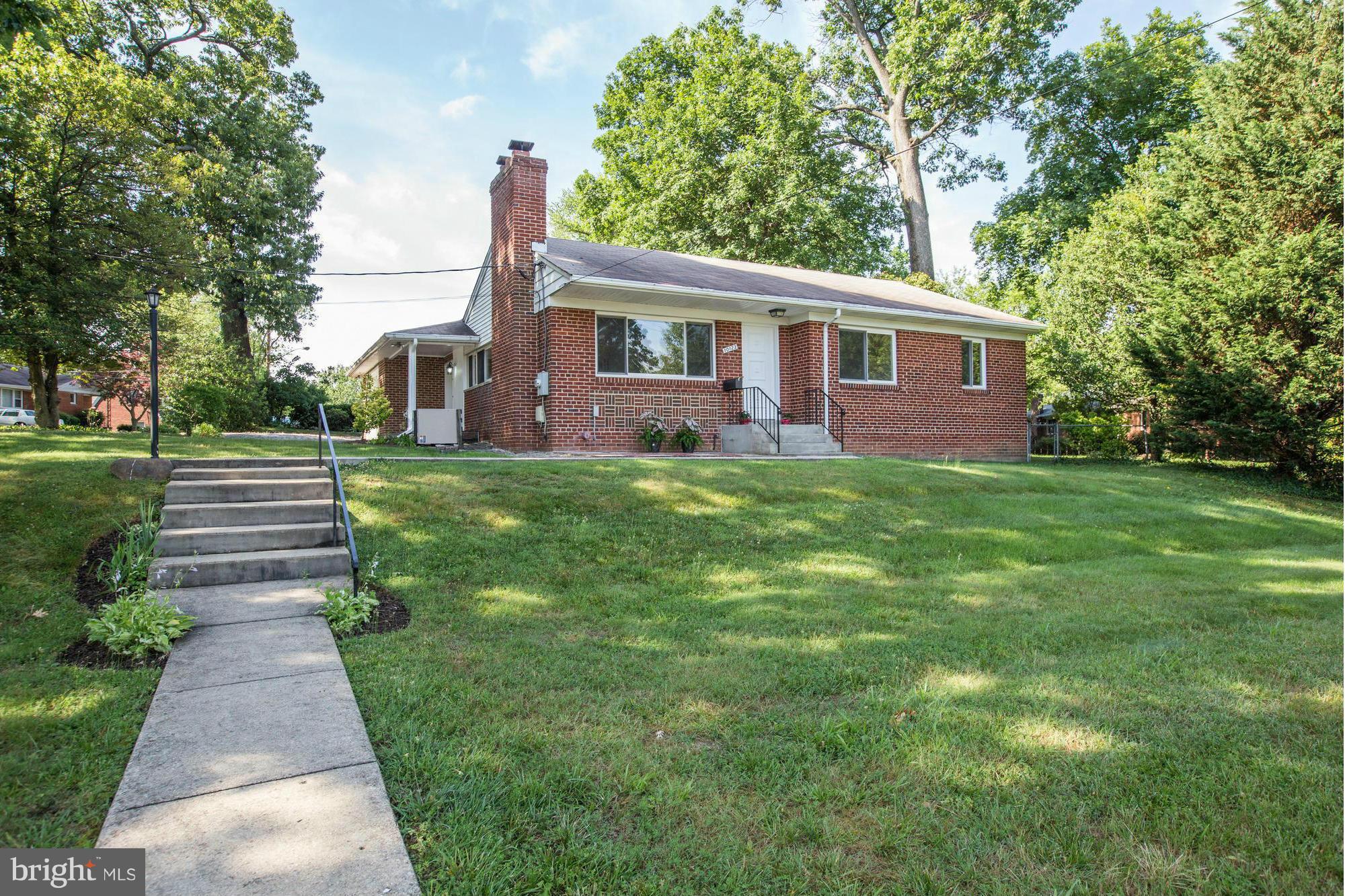 10123 Renfrew Road Silver Spring, MD 20901 - Photo 1 of 18 a front view of a house with a yard