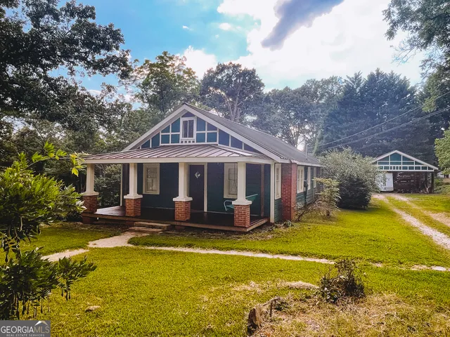 a house with garden in front of it