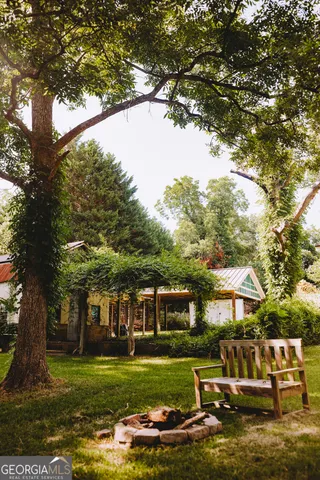 a bathroom with a toilet a sink and a window
