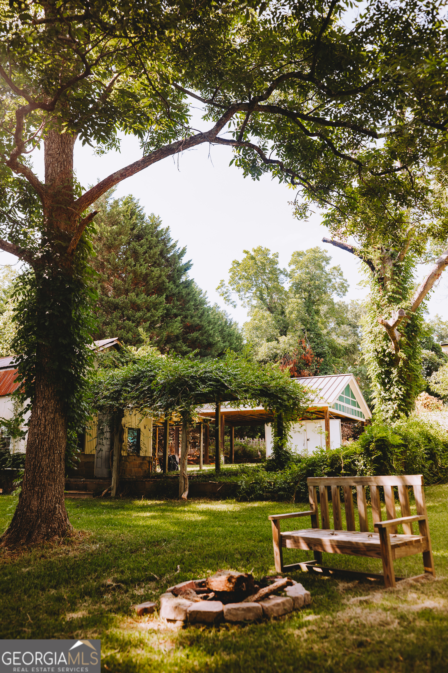 178 Mitchell Street Toccoa, GA 30577 - Photo 16 of 70 a front view of a house with a garden and trees