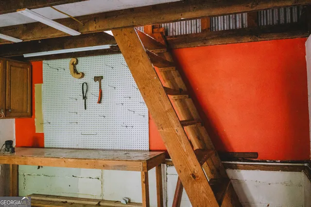 a bedroom with a large bed and window