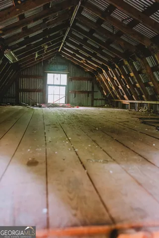 a view of a livingroom with furniture and window