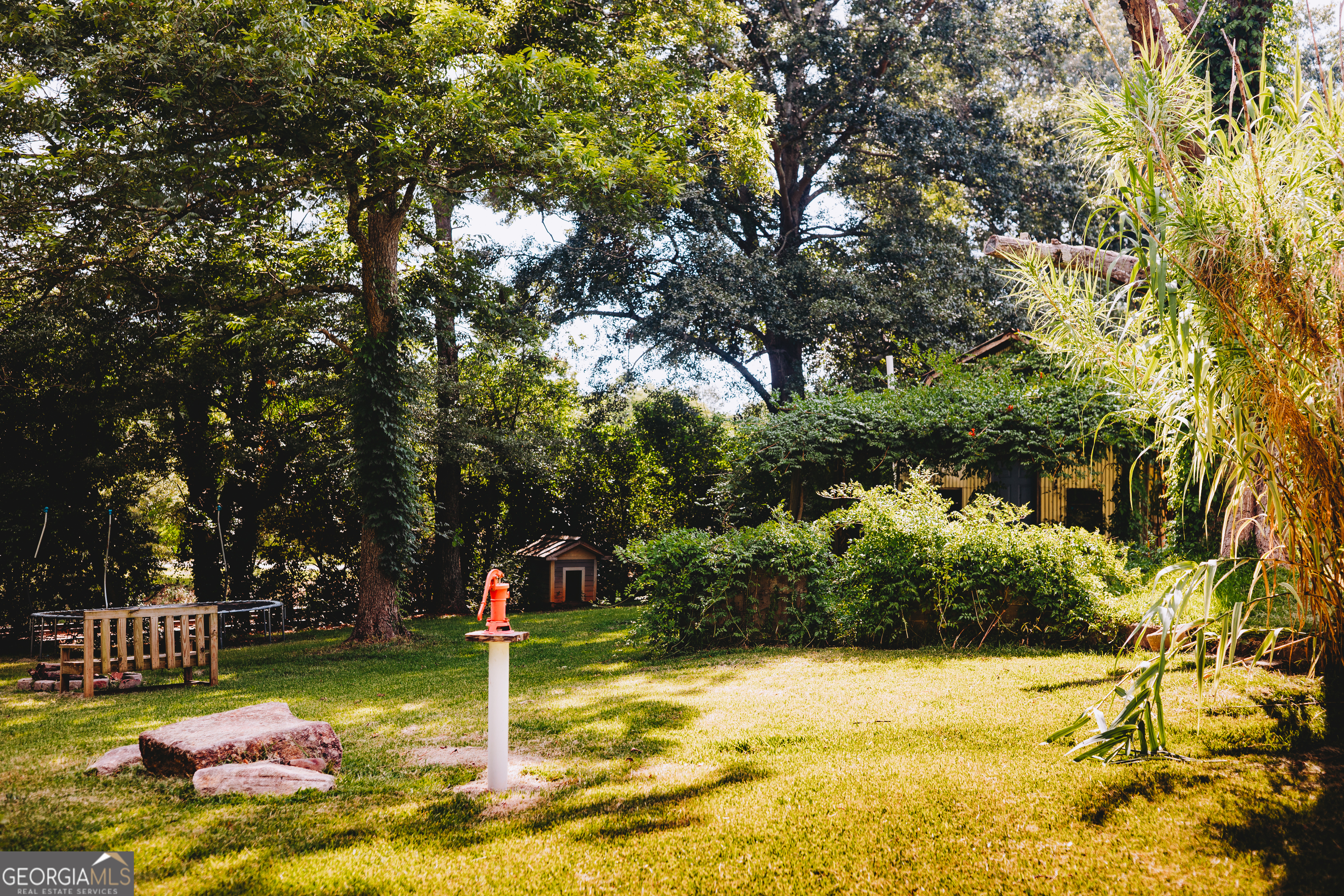 178 Mitchell Street Toccoa, GA 30577 - Photo 23 of 70 a flag is sitting in the middle of a yard