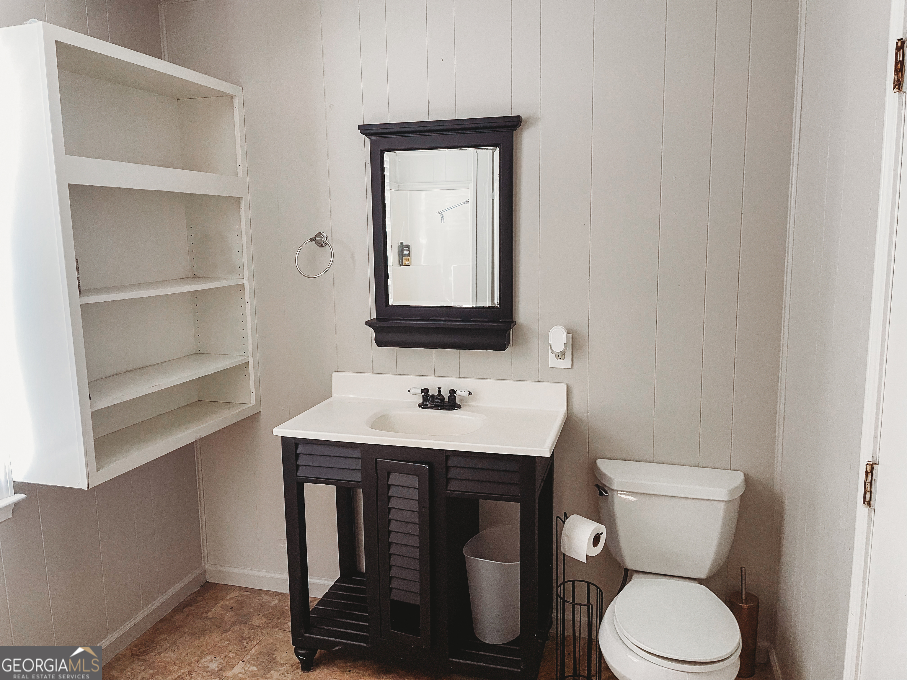 178 Mitchell Street Toccoa, GA 30577 - Photo 25 of 70 a bathroom with a toilet a sink and a window