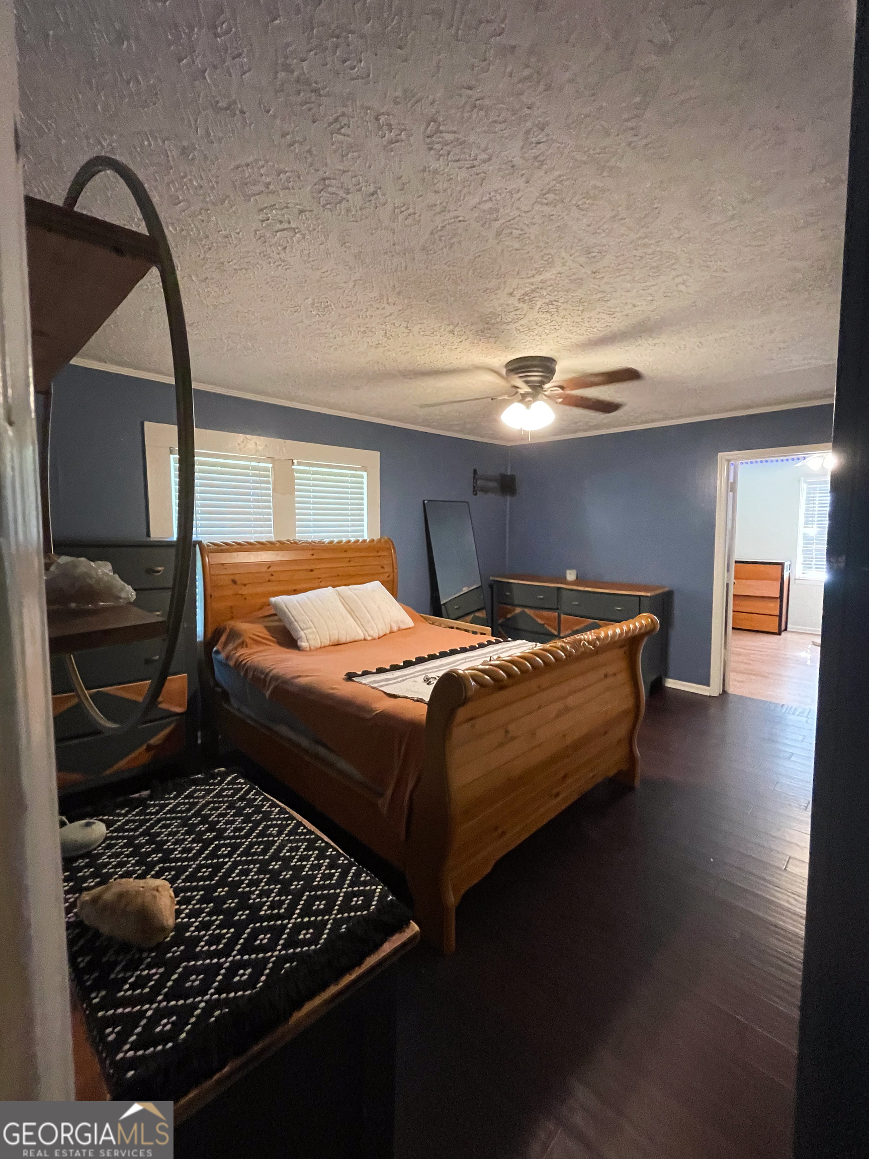 178 Mitchell Street Toccoa, GA 30577 - Photo 30 of 70 a bedroom with a bed and a mirror