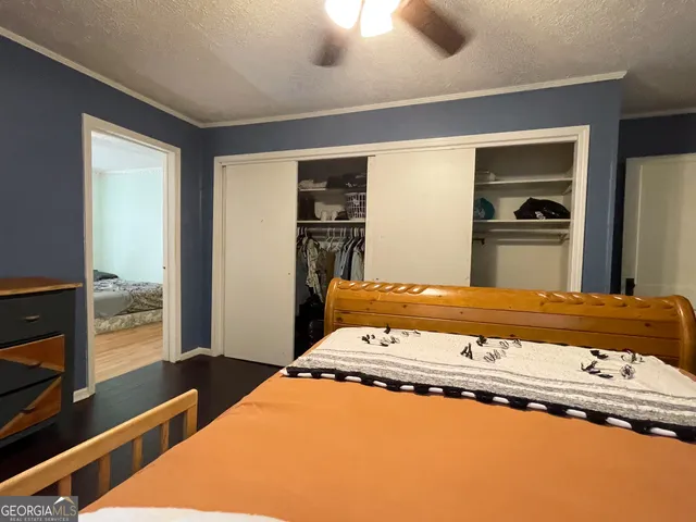a view of a hallway with wooden shelves