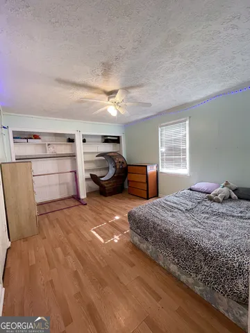 a bed room with a bed and a dresser