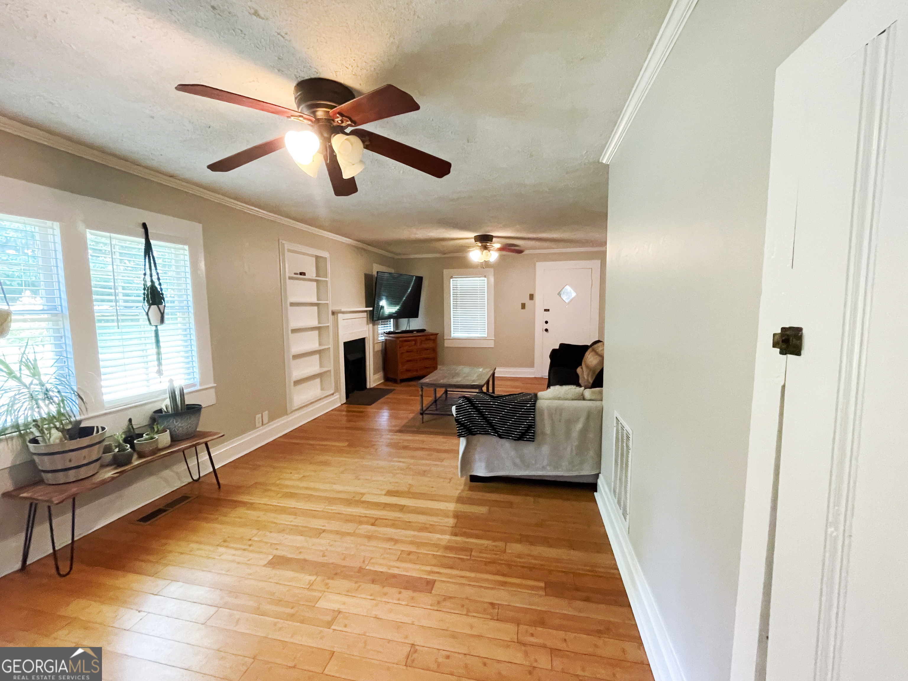 178 Mitchell Street Toccoa, GA 30577 - Photo 36 of 70 a living room with furniture and a wooden floor