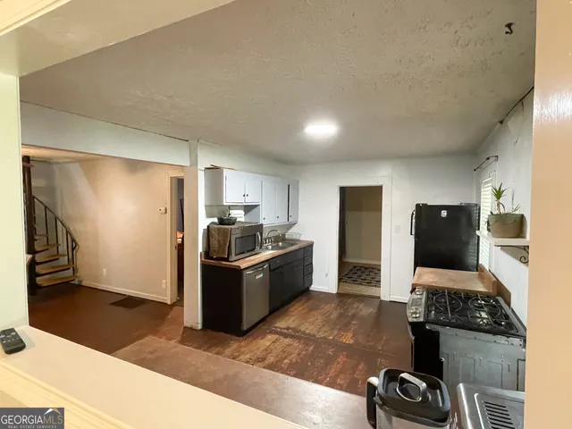 a view of bathroom with a toilet and a sink