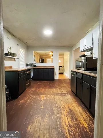 a bedroom with furniture and a potted plant