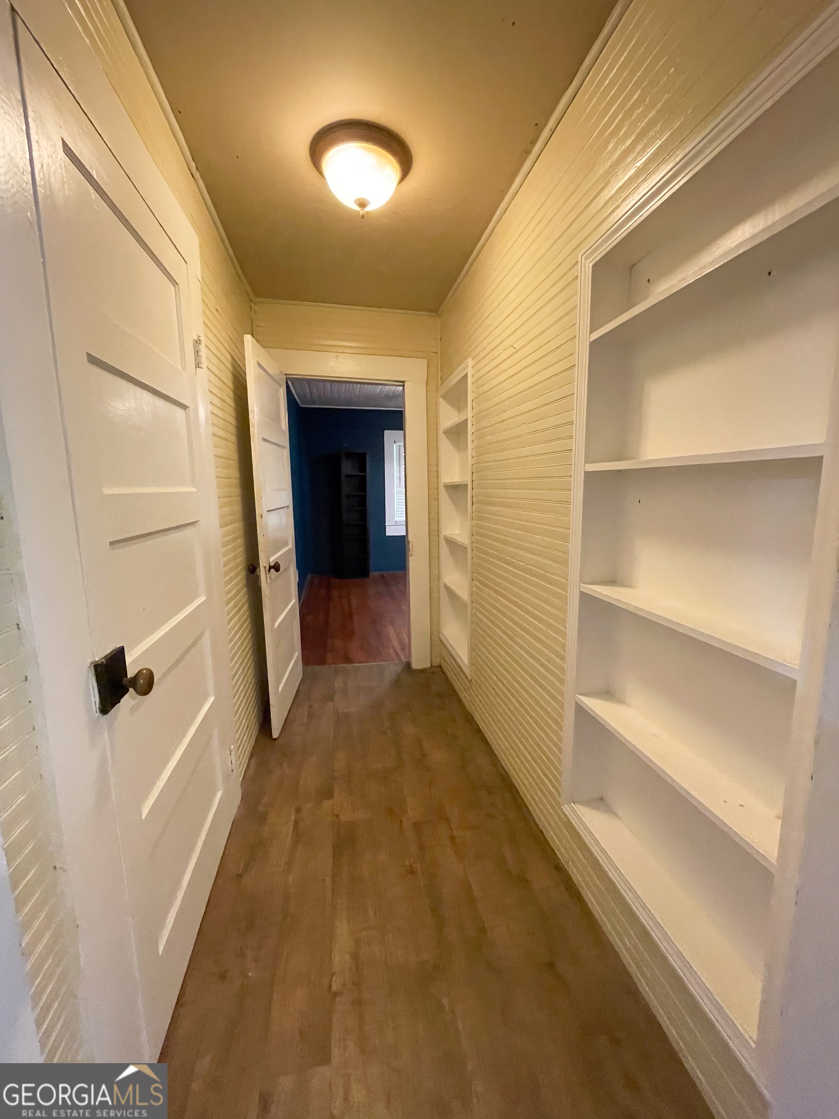 178 Mitchell Street Toccoa, GA 30577 - Photo 47 of 70 a view of a hallway with wooden shelves
