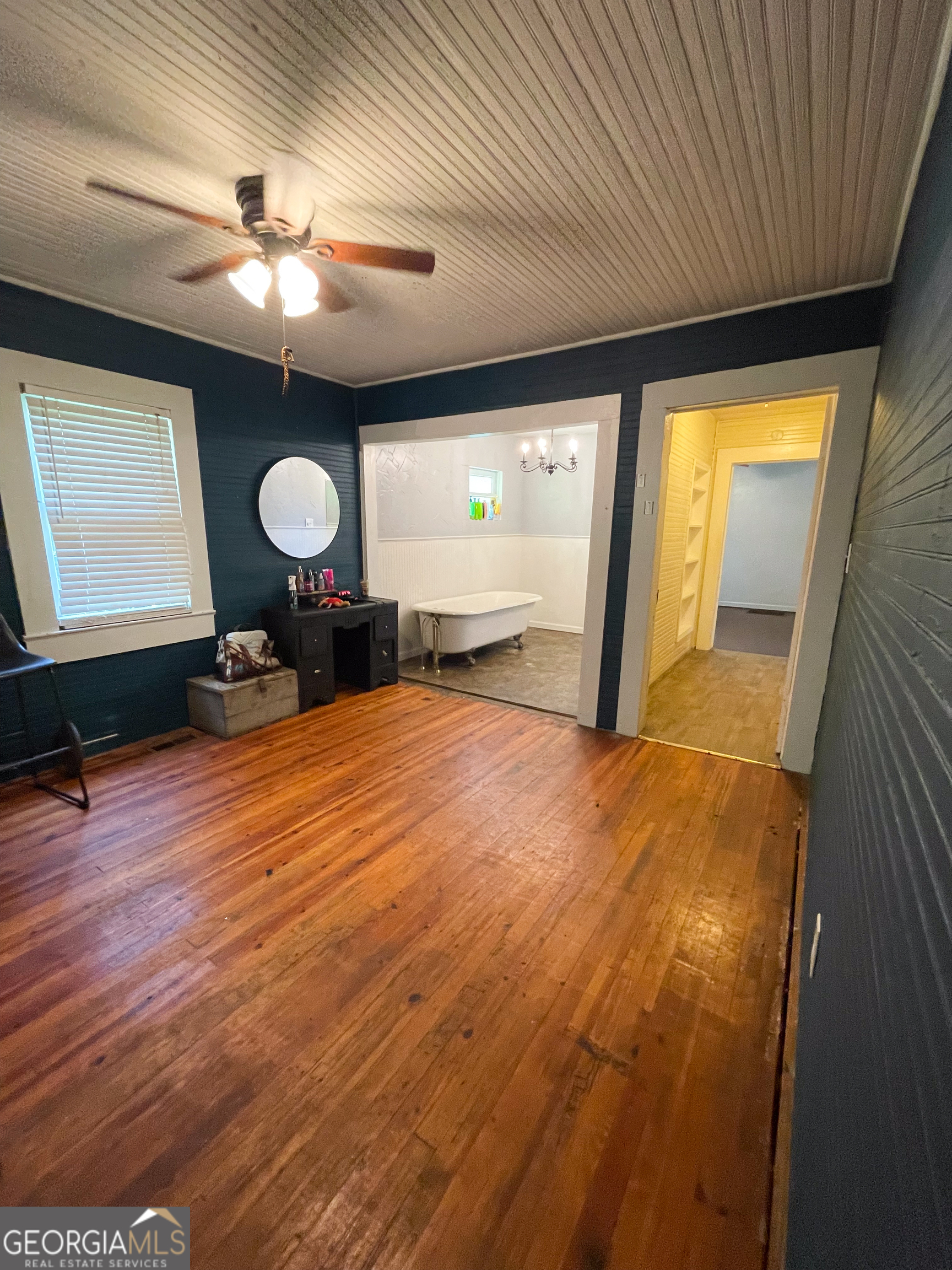 178 Mitchell Street Toccoa, GA 30577 - Photo 50 of 70 a bedroom with a bed and a chandelier