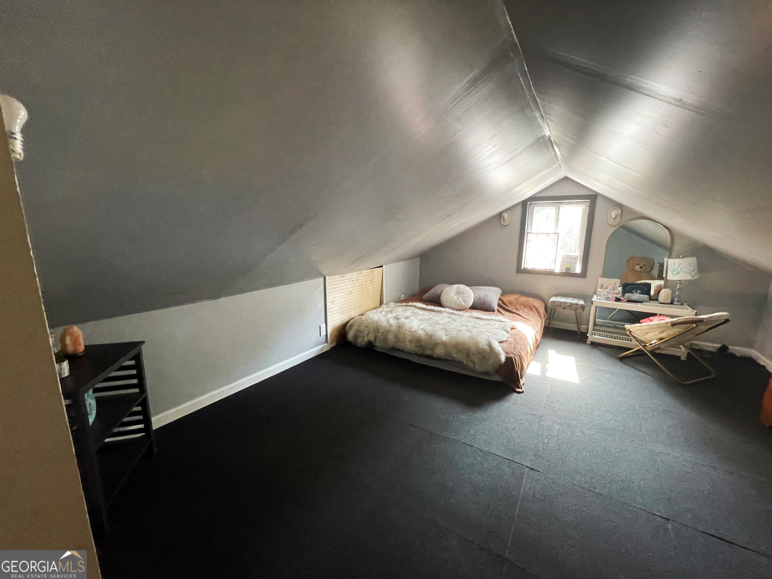 178 Mitchell Street Toccoa, GA 30577 - Photo 60 of 70 a bedroom with furniture and a potted plant