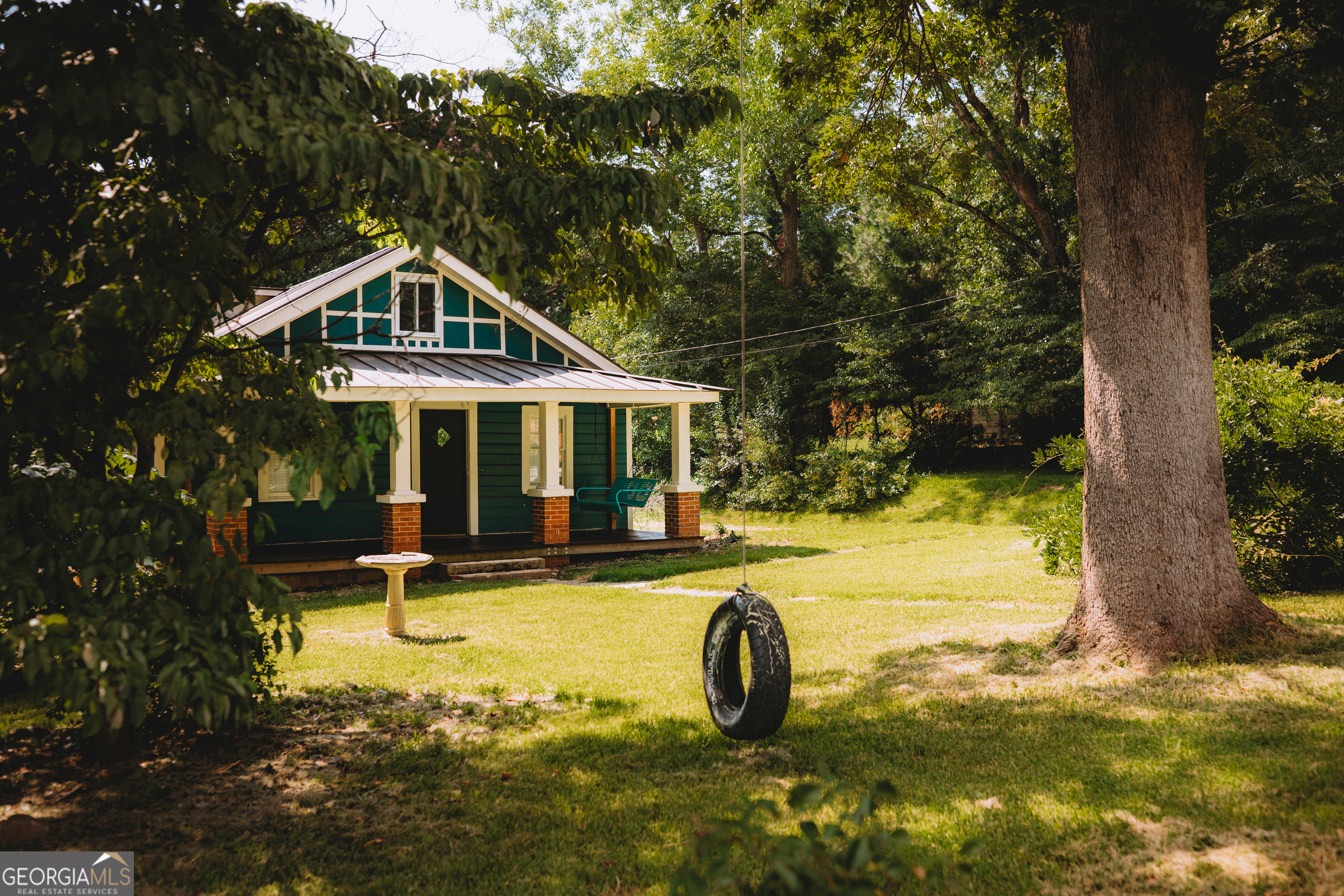 178 Mitchell Street Toccoa, GA 30577 - Photo 6 of 70 a front view of a house with swimming pool and porch