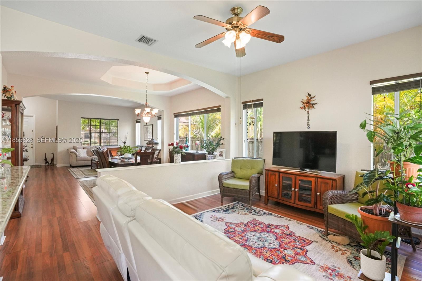 9506 Southwest 220th Lane Cutler Bay, FL 33190 - Photo 18 of 51 a living room with furniture and a flat screen tv