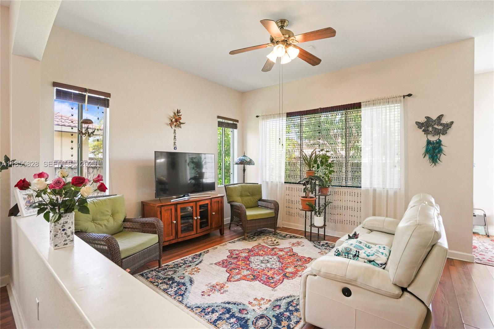 9506 Southwest 220th Lane Cutler Bay, FL 33190 - Photo 21 of 51 a living room with furniture and a flat screen tv