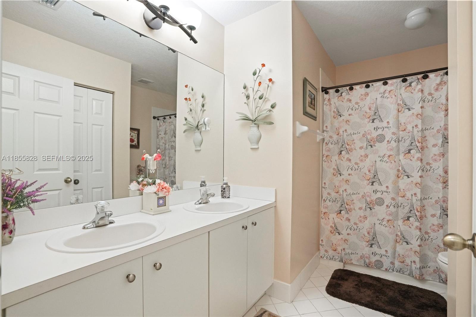 9506 Southwest 220th Lane Cutler Bay, FL 33190 - Photo 23 of 51 a bathroom with a sink and a mirror