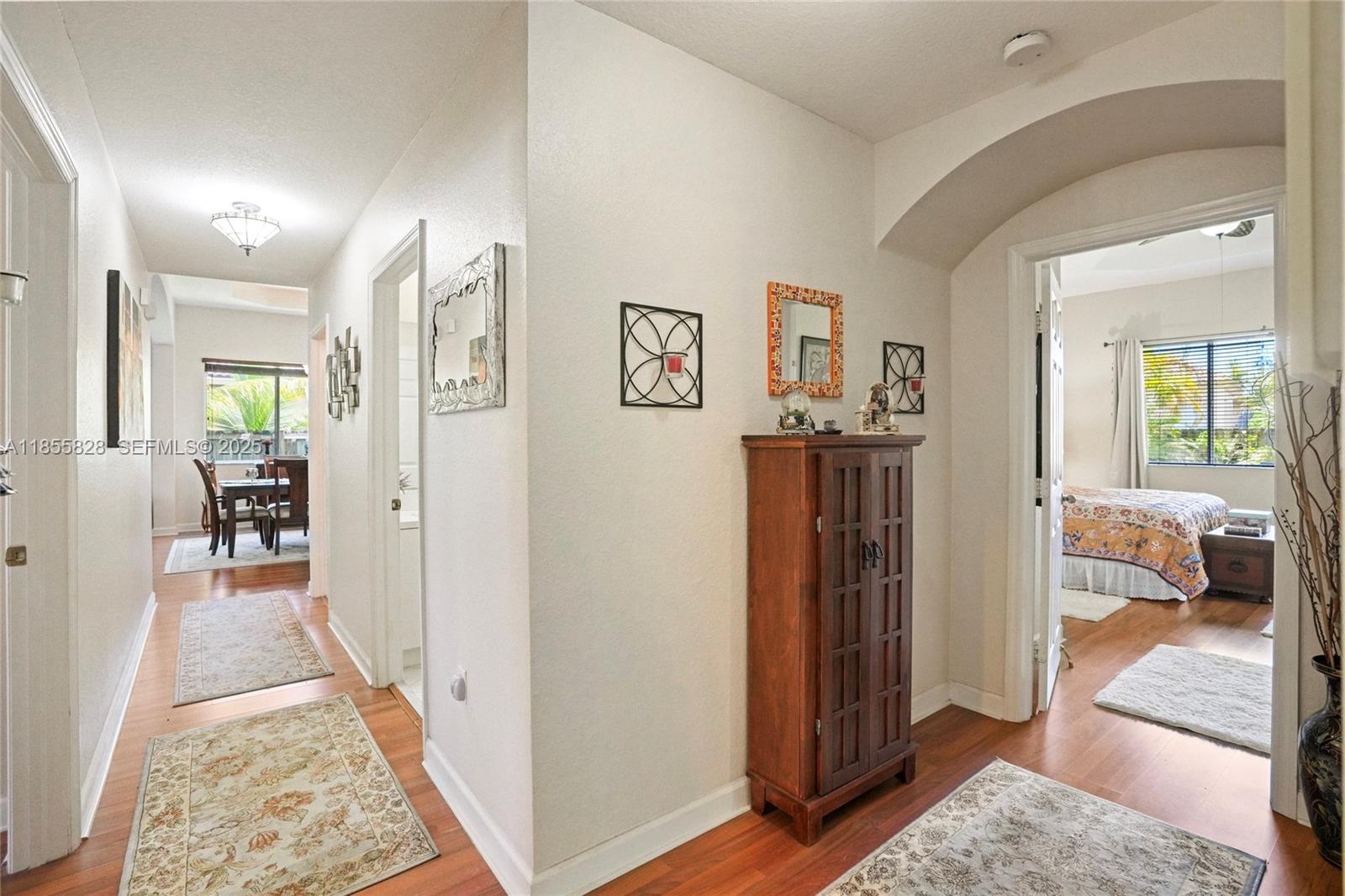 9506 Southwest 220th Lane Cutler Bay, FL 33190 - Photo 31 of 51 a view of a hallway view with living room and bedroom