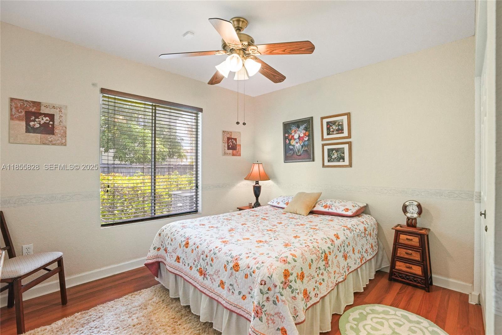 9506 Southwest 220th Lane Cutler Bay, FL 33190 - Photo 32 of 51 a bedroom with a bed and a window