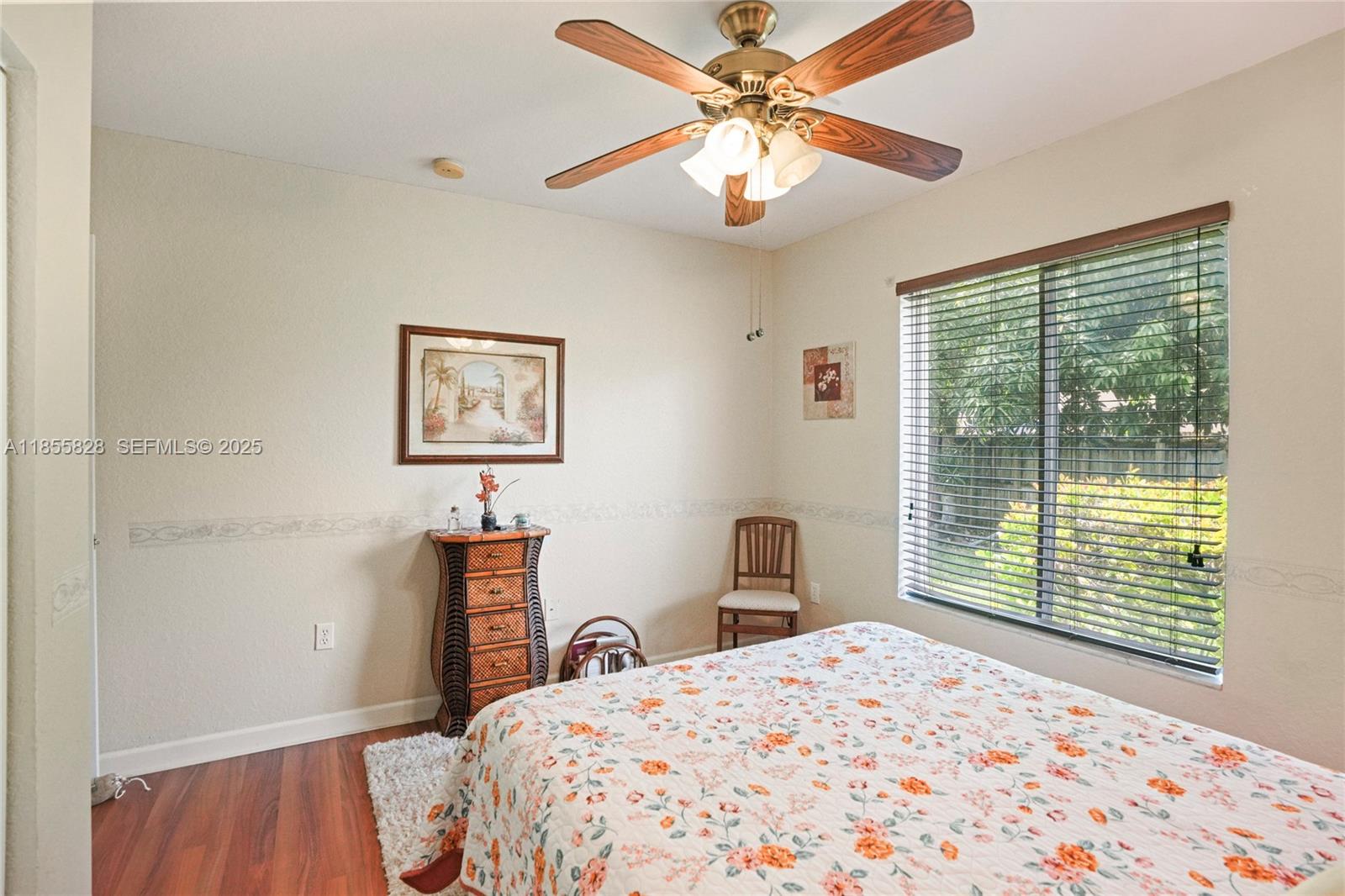 9506 Southwest 220th Lane Cutler Bay, FL 33190 - Photo 33 of 51 a bedroom with a bed and a window