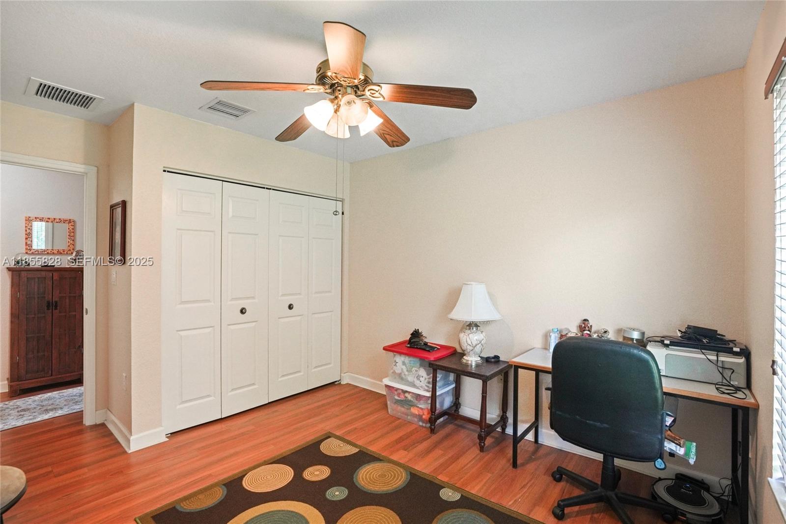 9506 Southwest 220th Lane Cutler Bay, FL 33190 - Photo 36 of 51 a workspace room with furniture and wooden floor