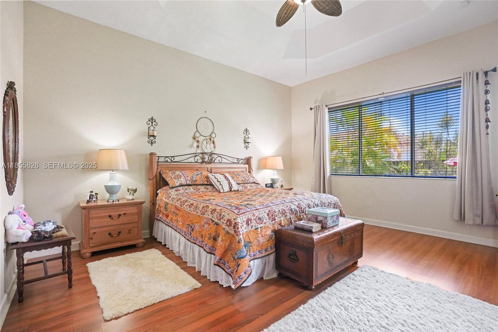 9506 Southwest 220th Lane Cutler Bay, FL 33190 - Photo 37 of 51 a bedroom with a bed and wooden floor