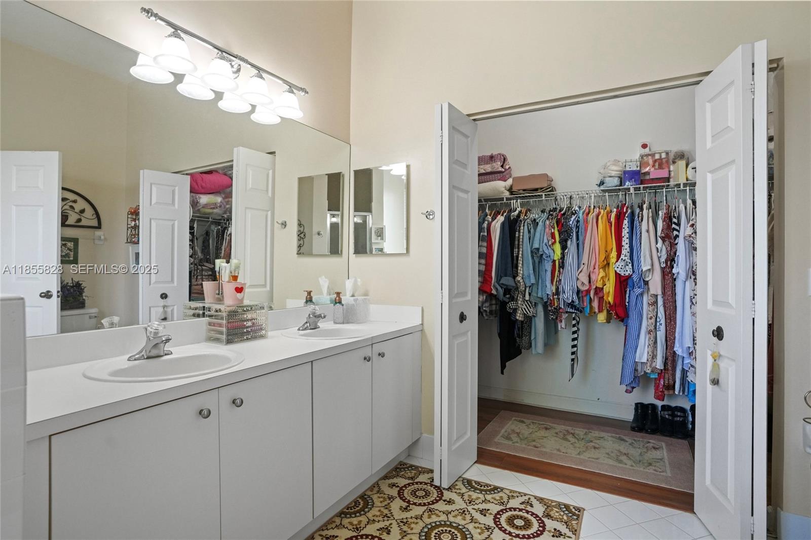 9506 Southwest 220th Lane Cutler Bay, FL 33190 - Photo 43 of 51 a view of a hallway with a mirror and cabinets