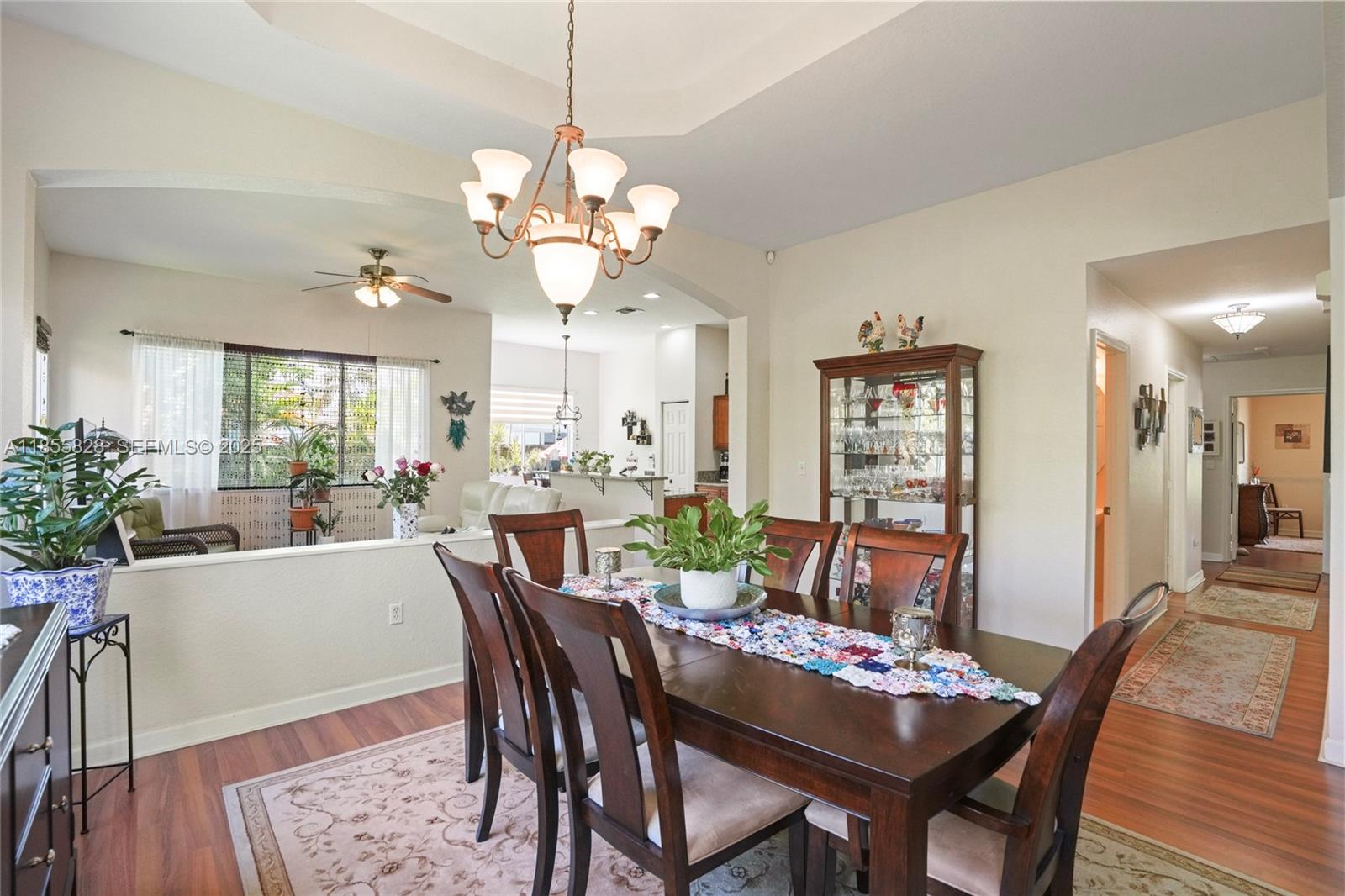 9506 Southwest 220th Lane Cutler Bay, FL 33190 - Photo 8 of 51 a view of a dining room with furniture and wooden floor