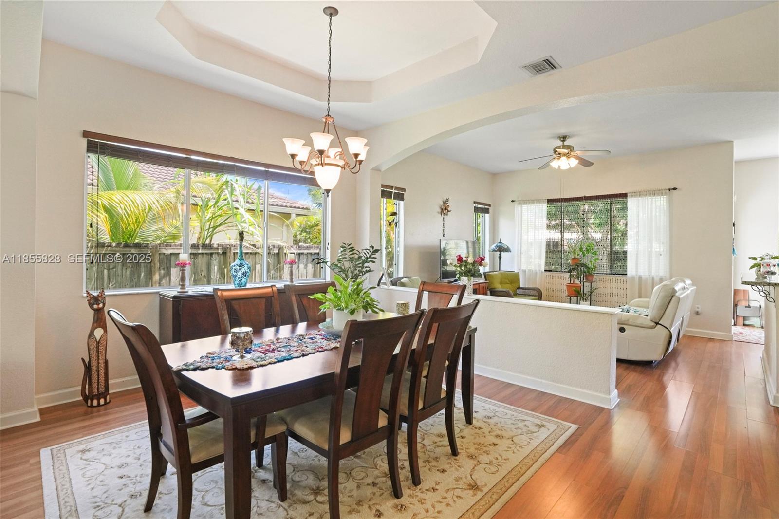9506 Southwest 220th Lane Cutler Bay, FL 33190 - Photo 10 of 51 a view of a dining room with furniture window and wooden floor