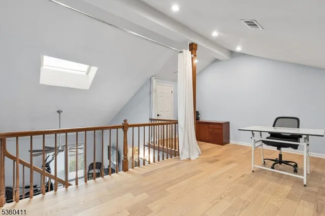 a view of a workspace with furniture