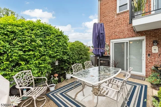 a view of a tables and chairs in patio