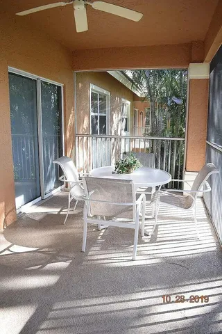 a view of a living room and floor to ceiling window