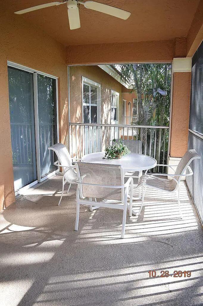 8356 Mulligan Circle, Unit 1924A Port St. Lucie, FL 34986 - Photo 13 of 15 a view of a living room and floor to ceiling window
