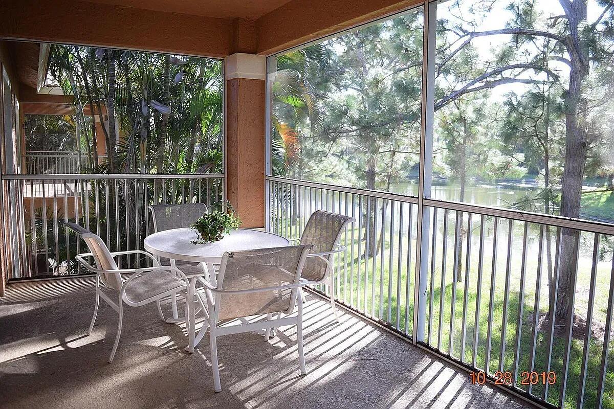 8356 Mulligan Circle, Unit 1924A Port St. Lucie, FL 34986 - Photo 14 of 15 a view of a two chairs in the balcony