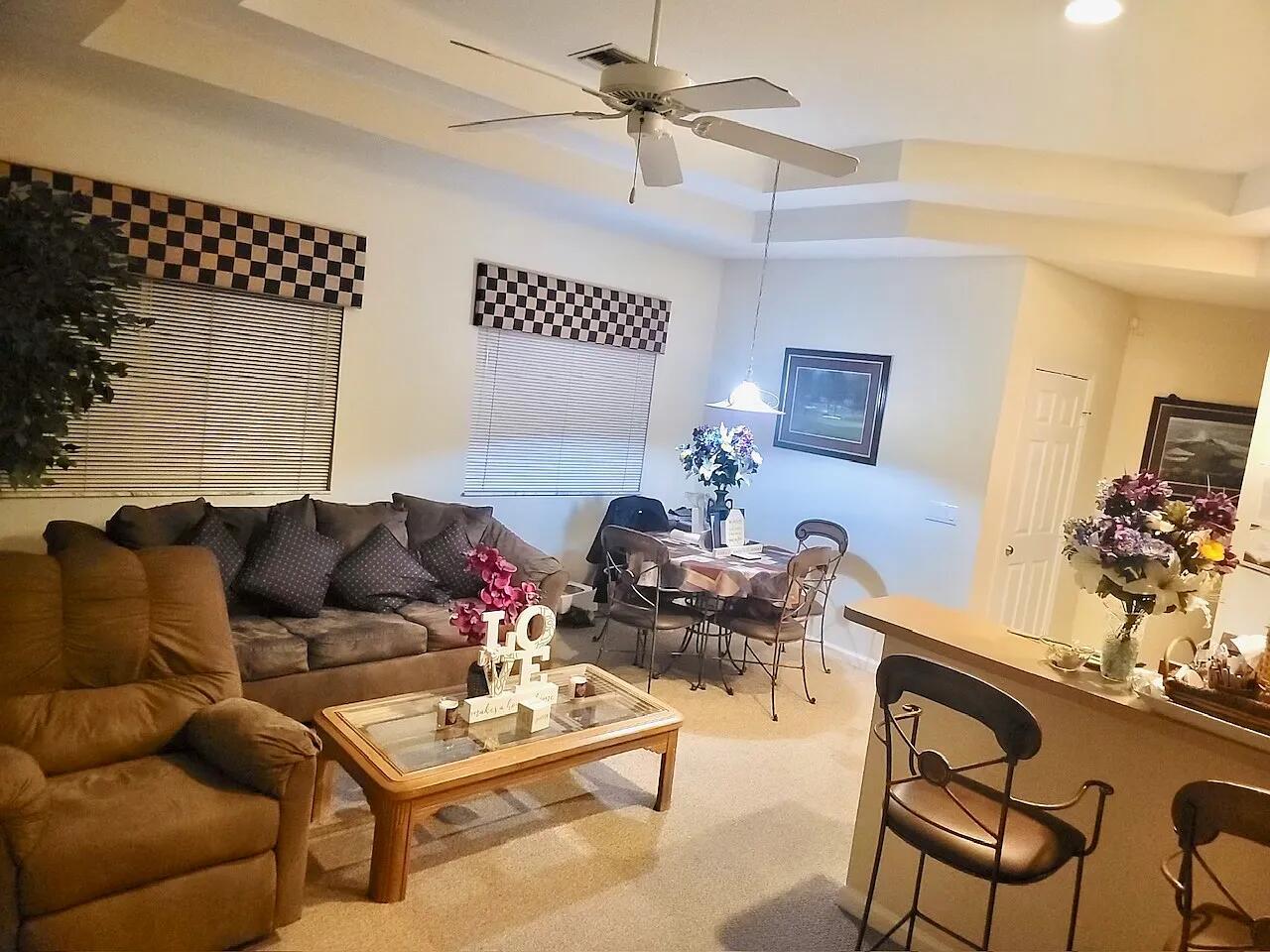 8356 Mulligan Circle, Unit 1924A Port St. Lucie, FL 34986 - Photo 7 of 15 a living room with furniture
