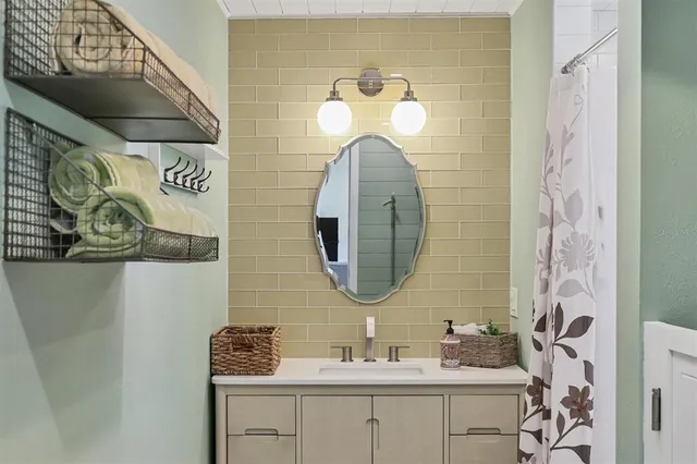 a bathroom with a sink and a mirror