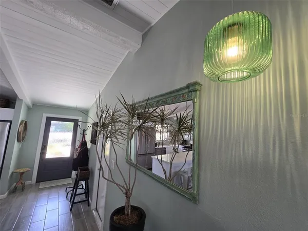 an entryway with a mirror