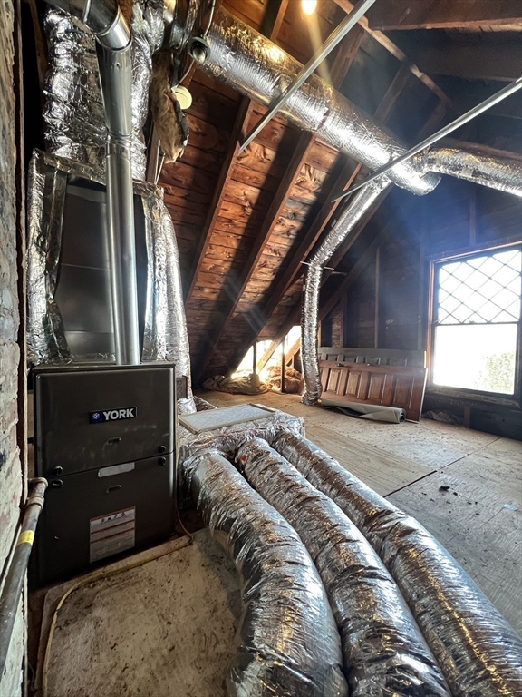 482 Holyoke Street Ludlow, MA 01056 - Photo 18 of 19 a bed sitting in a bedroom next to a window