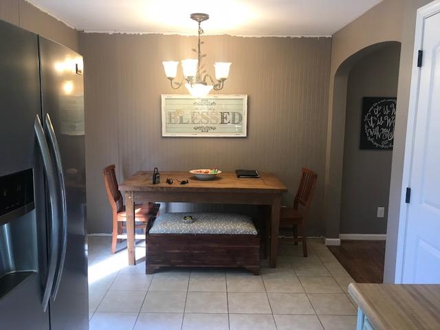 11665 Owens Chapel Road Springfield, TN 37172 - Photo 11 of 25 a dining room with a wooden table and chairs
