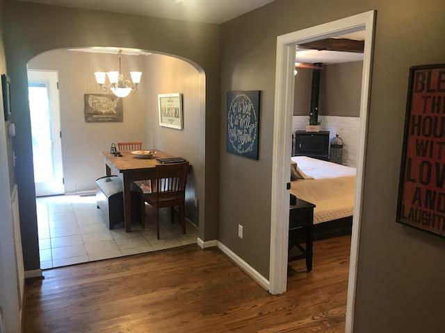 11665 Owens Chapel Road Springfield, TN 37172 - Photo 12 of 25 a view of a dining room with furniture and wooden floor