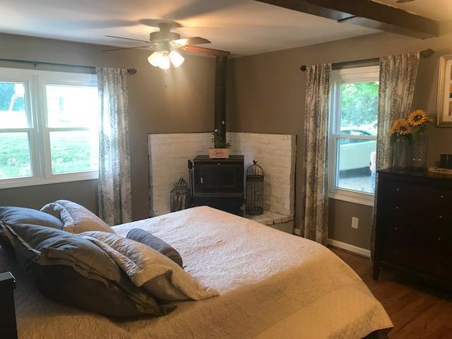 11665 Owens Chapel Road Springfield, TN 37172 - Photo 13 of 25 a bedroom with a bed and a chandelier