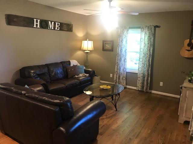 11665 Owens Chapel Road Springfield, TN 37172 - Photo 3 of 25 a living room with furniture and wooden floor