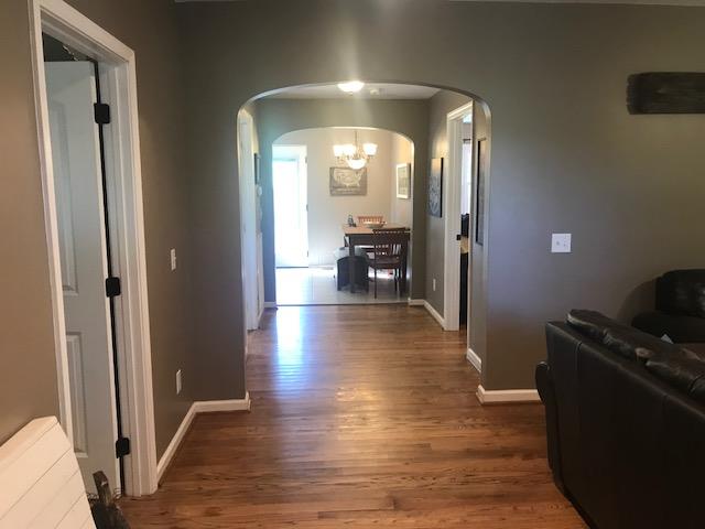 11665 Owens Chapel Road Springfield, TN 37172 - Photo 4 of 25 a view of a hallway with wooden floor and furniture