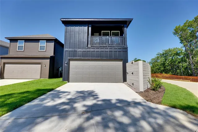 a view of balcony with two chairs and a potted plant