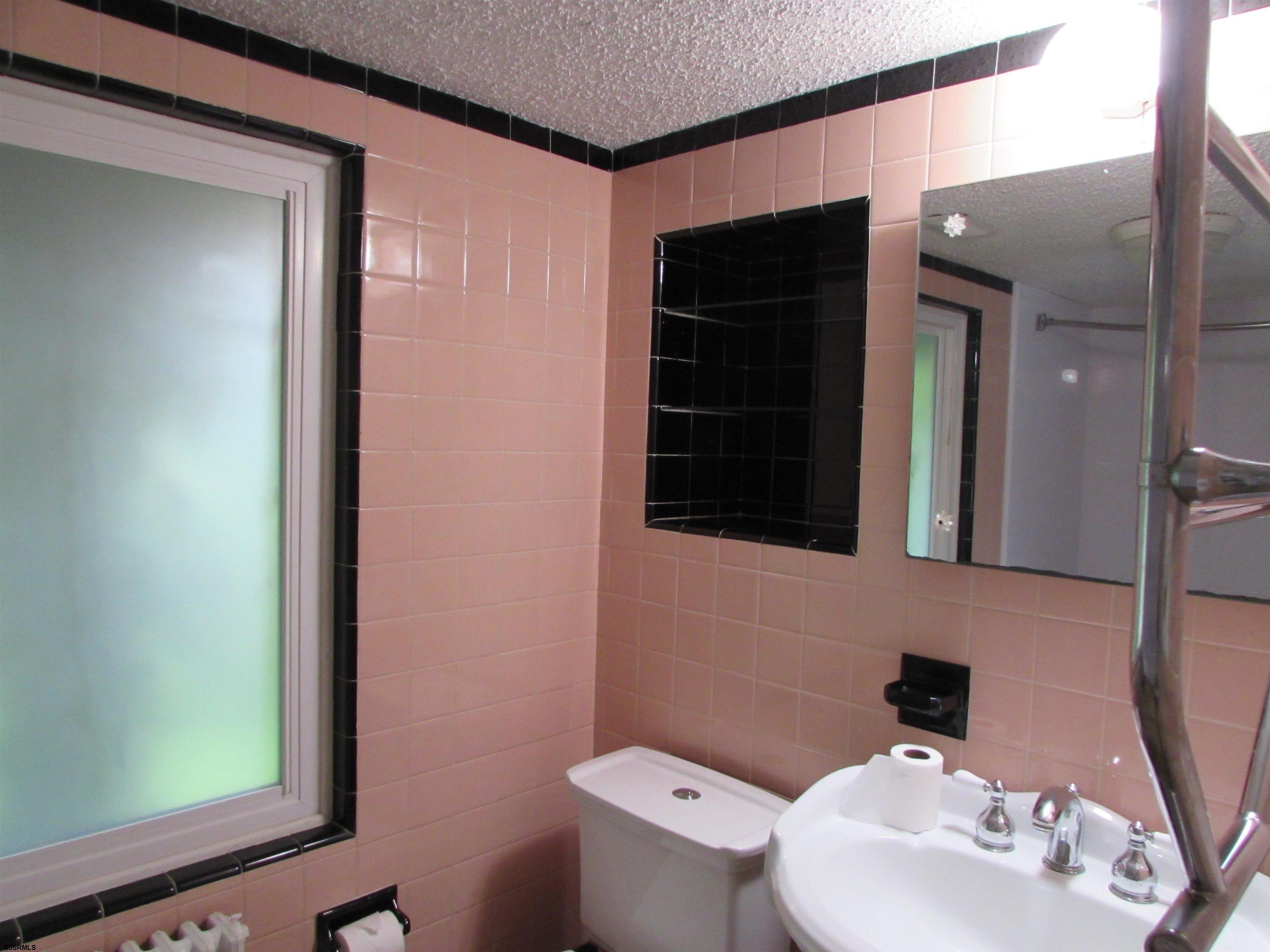 744 Shore Road Linwood, NJ 08221 - Photo 36 of 43 a bathroom with a sink a toilet and shower