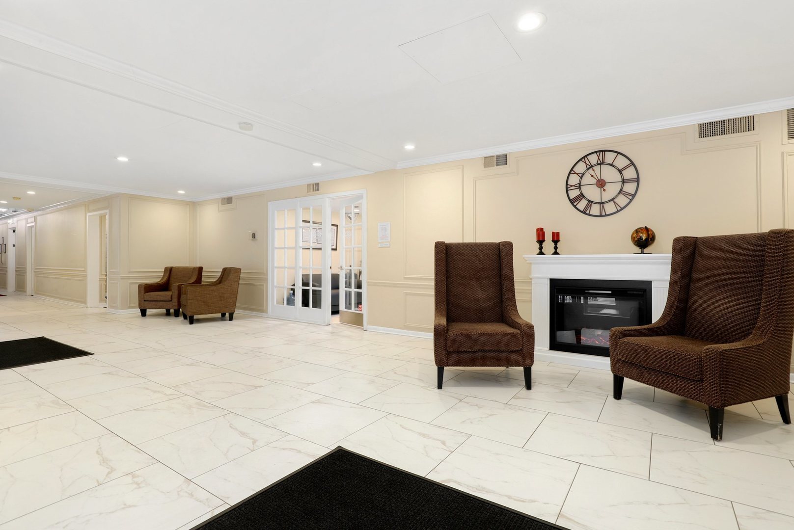 Undisclosed Address Chicago, IL 60657 - Photo 15 of 18 a living room with furniture a clock and a fireplace