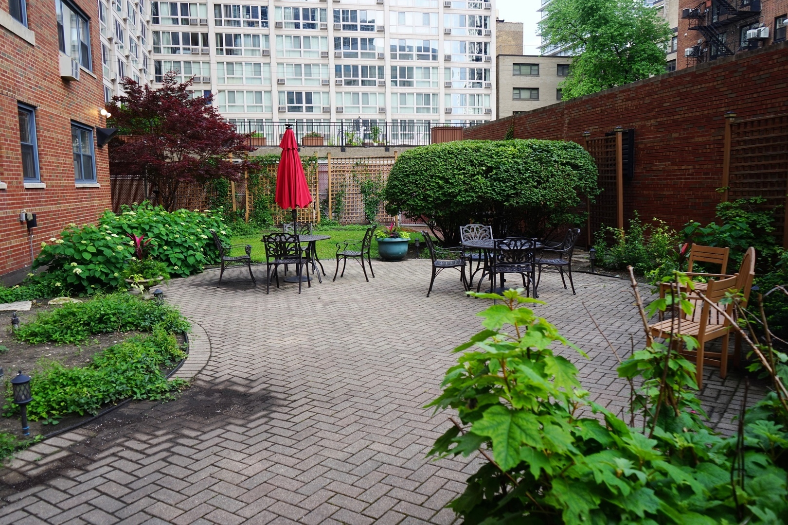 Undisclosed Address Chicago, IL 60657 - Photo 16 of 18 a view of a chairs and table in a backyard